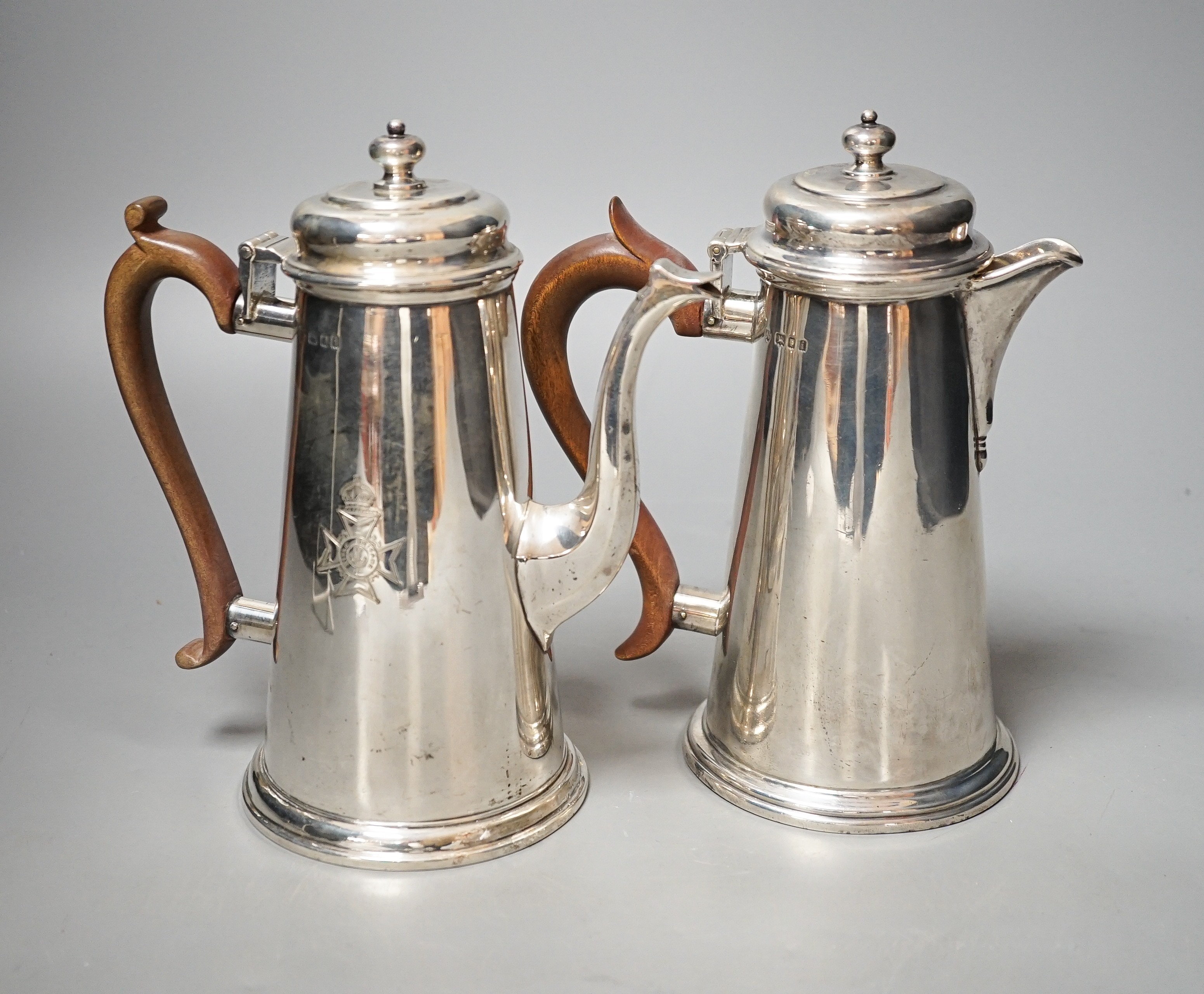 A George V cafe au lait pair, by Tessiers Ltd, London, 1924, engraved with Rifle Brigade crest, height 19.4cm, gross 33oz.